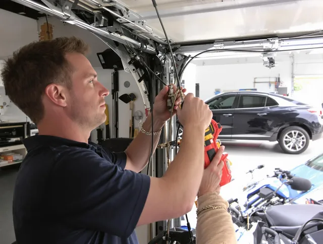 St. Petersburg Garage Door Repair safety certified technician performing cable replacement in St. Petersburg