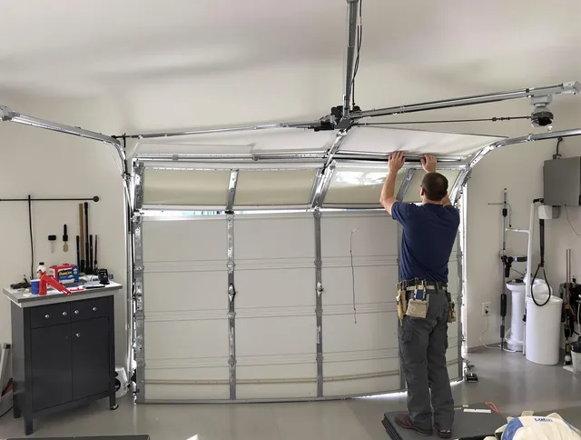 St. Petersburg Garage Door Repair specialist performing precise section replacement on St. Petersburg garage door